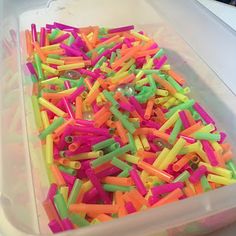 a plastic container filled with lots of colorful sprinkles