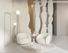 two white chairs sitting next to each other in front of a tall mirror on the wall