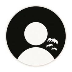 a black and white circle with bats on it