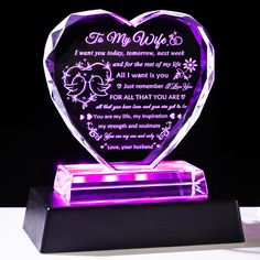 a purple heart shaped glass award with an inscription on the front and bottom, which reads to my wife