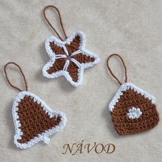 three crocheted ornaments are sitting on the ground