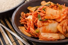 some food is in a black bowl on a table