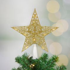 a gold star on top of a christmas tree