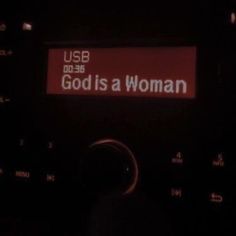 a radio with the words god is a woman on it