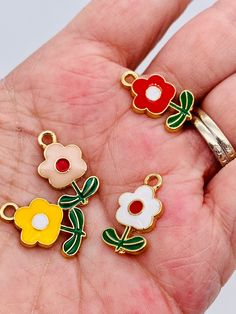 Cute flower charms available in red, yellow, white or pink. Great for charm bracelets. Size Cheap Summer Earrings With Flower Charm, Multicolor Flower Shaped Jewelry With Charms, Multicolor Flower-shaped Jewelry With Charms, White Flower Charms Jewelry, White Enamel Charms For Jewelry Making, White Flower Charm Jewelry, Beading For Kids, Charms Bracelet, Bracelet Charms