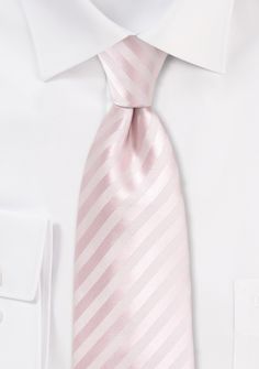 Elevate your style with the Blush Narrow Striped Necktie, a sophisticated accessory that adds a touch of charm to any ensemble. Whether you're shopping for men's suits or preparing for a special occasion, this necktie is a must-have. The delicate blush color exudes elegance and refinement, while the narrow striped pattern adds a hint of texture and interest. It pairs beautifully with a variety of suit colors, from navy to charcoal, allowing you to create a polished and put-together look. Make a Elegant White Ties For Spring, Elegant White Spring Ties, Elegant Suit And Tie Accessories For Business In Spring, Elegant Spring Business Suit And Tie Accessories, Elegant Pink Standard Tie, Elegant Business Ties For Spring, Elegant Spring Business Ties, Elegant Pink Ties For Black Tie Occasions, Elegant Pink Standard Tie And Accessories