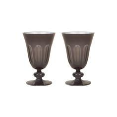 two brown glass vases sitting next to each other on a white background, one is empty