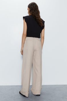 Turn-up hem detailing adds interest 
 Wide leg silhouette flatters the figure 
 High-waisted fit creates a polished look 
 Pleated front and side pockets provide visual appeal 
This pair of wide leg trousers from Warehouse makes a versatile addition to your wardrobe. Crafted from a polyester-viscose blend with a fine twill texture, these trousers offer a flattering silhouette. The high-waisted fit creates an elegant shape, while the turn-up hem detailing adds interest. Pleats at the front and side pockets provide further visual appeal. 
Style these trousers with a sleeveless top and flat sandals for a chic daytime look. Their wide leg shape moves beautifully as you walk. For evenings out, pair them with a camisole or bardot top and strappy heels. Their lightweight fabric allows for easy Going Out Trousers, Bardot Top, Oasis Fashion, Puff Sleeve Dresses, Navy Dress, Blazer Dress, Fashion Face, Polished Look, Strappy Heels