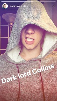 a man wearing a hoodie with the words dark lord collins on it