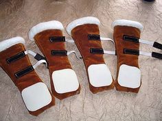 five pairs of foot pads sitting on top of a floor