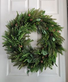 This wreath is designed with and assortment of real touch pines and eucalyptus. 24" Neutral Winter Decor, Spring Furniture, Winter Table, Organic Decor, Real Touch Flowers, Greenery Wreath, Holiday Christmas Tree, Festive Tables, Spring Easter Decor