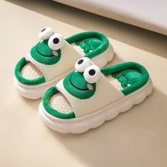 Step into whimsical comfort with these adorable frog slippers 🐸! Crafted with plush materials, they'll keep your feet cozy and warm. Embrace the cuteness and add a touch of fun to your relaxation routine. ✨ For more cozy slippers: https://www.etsy.com/shop/CozySlippers4U Cute Green Non-slip Slippers, Fun Synthetic Slippers For Indoor Use, Fun Synthetic Indoor Slippers, Fun Indoor Synthetic Slippers, Cute Green Slippers With Round Toe, Cute Indoor Open Toe Slippers, Playful Indoor Synthetic Slippers, Cute Open Toe Indoor Slippers, Comfortable Synthetic Slippers For Playtime