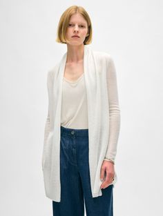 The longest-running piece at White + Warren, the Cashmere Trapeze Cardigan is a chic fingertip-length open sweater that works on every body type. No matter what color you choose, you'll want to wear this timeless style season after season. Details Straight fit. Long sleeve. Length in size small is 32.5" The model is 5'11" and is wearing a size small. 100% Cashmere. Hand wash cold or dry clean. Do not twist or wring. Reshape and lay flat to dry. Warm iron if needed. Style #11092 Elegant Everyday Cardigan With Relaxed Fit, Spring Cashmere Sweater For Layering, Elegant White Everyday Cardigan, Elegant Fine Knit Spring Outerwear, Relaxed Fit Open Front Sweater For Layering, Long Sleeve Cashmere Cardigan For Spring, Everyday Fitted Fine Knit Cardigan, Classic Spring Cardigan For Layering, Spring Cashmere Sweater Coat For Daywear