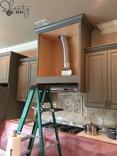 a kitchen that is being remodeled and painted