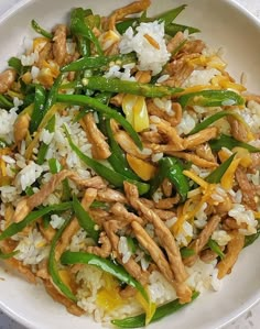 a white bowl filled with rice and green beans