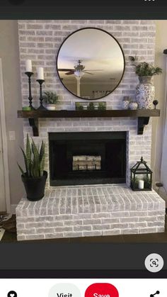 a white brick fireplace with a mirror above it