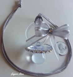 a necklace with a bow and some beads