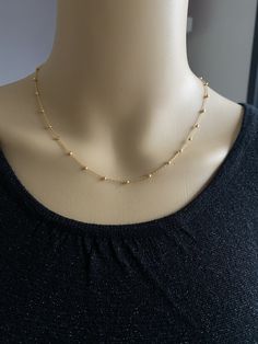 Fine chain necklace plated with 18-carat fine gold with golden pearls 1.5 cm apart. Small golden heart at the end of the chain. 3 lengths available: 40 cm + 5 cm (extension chain) 45 cm + 5 cm (extension chain) 50 cm + 5 cm (extension chain) You can also make me a custom request in the field provided for this purpose when ordering or by sending me a private message :) 18K GOLD PLATE Stainless, hypoallergenic, resistant, does not stain INTERNATIONAL SHIPPING Fast and careful delivery (24h to 48h) Delicate Gold Chain Necklace With Tiny Beads, Gold Chain Necklace With Tiny Beads For Gift, Gold Plated Dainty Beaded Necklaces, Gold Chain Necklace With Tiny Beads As Gift, Dainty Gold Beaded Necklace With Delicate Chain, Dainty Gold-plated Necklace With Gold Beads, Delicate Gold Charm Necklace With Beaded Chain, Gold Charm Necklace With Beaded Chain In Delicate Style, Gold Station Necklace With Beaded Chain