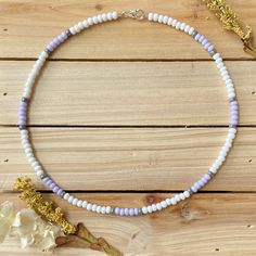 The Lavender Dream beaded choker is just what you need for any occasion that might come your way. This sublet necklace is perfect for a winter day at home or a sunny day on the beach. All chokers are customizable to the size you need so please be sure to measure your neck where you want your choker to sit and order accordingly! This high quality beaded choker is beautiful worn on its own or layered. It is secured with a sterling silver lobster claw and made with glass beads that can stand the te Handmade Adjustable Lavender Beaded Necklaces, Handmade Lavender Beaded Necklaces, Summer Purple Beaded Necklaces With Colorful Beads, Summer Purple Beaded Necklace With Colorful Beads, Summer Gift Purple Beaded Necklaces, Adjustable Purple Choker With Colorful Beads, Purple Beaded Choker With Round Beads, Lavender Necklaces With Colorful Round Beads, Lavender Necklace With Colorful Round Beads