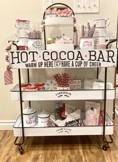 a cart with hot cocoa bar items on it