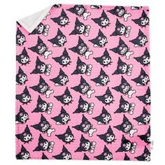 a pink blanket with black and white cartoon characters on it, all over the surface