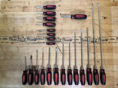 the tools are lined up on the table to be used in this workbench