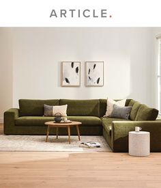 a living room scene with focus on the couch and coffee table in the foreground