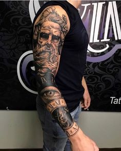 a man with a tattoo on his arm