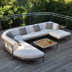 a couch and coffee table on a wooden deck