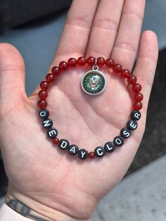 "6mm Red Carnelian Gemstone Bracelet. Choose your US military branch. \"One Day Closer\"~ A reminder that with every day that passes, you are a little bit closer to seeing your loved soldier. Red Carnelian for Remembering Everyone Deployed. Warriors would string Carnelian around their neck to give them courage in battle. 20% of EVERY purchase will go to the Wounded Warrior Project! In honor of my Husband deployed and all the other US soldiers. ♥️ 🤍 💙" Gifts For Deployed Soldiers, Yellow Ribbon Deployment Military, Deployed Husband, Bracelets Red, Remember Everyone Deployed, Wounded Warrior Project, Military Bracelet, Military Jewelry, Military Branches