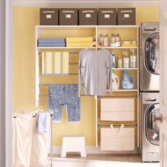 a laundry room with yellow walls and white flooring