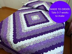 a purple and white quilted bedspread with the words made to order take 5 - 7 weeks to make