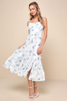 The perfect day has sunshine, a cutie on your arm, and the Lulus Airy Romance Ivory Floral Print Tiered Tie-Strap Midi Dress! Lightweight woven fabric, with a subtle floral jacquard effect and a darling blue floral print, shapes tying shoulder straps that support a bodice with a gathered bust, a sweetheart neckline, and a banded empire waist. A-line skirt falls to a tiered midi hem. Hidden zipper/clasp at back. Fit: This garment fits true to size. Length: Mid-calf length. Size medium measures 42 Spring Graduation Dress, Knot Tie Dress, Summer Graduation Dress, Midi Ruffle Dress, White Floral Dress, The Perfect Day, Empire Dress, Graduation Outfit, Floral Jacquard