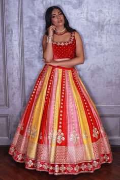 Multi colored lehenga in raw silk base with cutdana, zardozi and pearl floral embroidery. Comes with mulmul embroidered blouse and dupatta.
Component: 3
Pattern: Embroidered
Type Of Work: Zardozi, Pearls, Cutdana Floral Motifs
Neckline: U-Neck
Sleeve Type: Sleeveless
Fabric: Raw Silk, Mulmul
Color: Multi Color
Other Details: 
Sheer dupatta with tassel hem
Occasion: Destination Wedding - Aza Fashions Red Art Silk Lehenga With Gota Work, Navratri Meenakari Choli In Raw Silk, Multicolor Meenakari Raw Silk Sets, Kundan Lehenga With Gota Work For Traditional Ceremonies, Multicolor Raw Silk Choli With Meenakari, Bollywood Lehenga For Traditional Ceremonies With Gota Work, Bollywood Lehenga With Gota Work For Traditional Ceremonies, Bollywood Style Lehenga With Cutdana For Ceremonies, Multicolor Raw Silk Choli With Gota Work