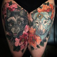 two wolf tattoos on both thighs with flowers