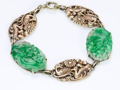 Carved Jade & Gold Bracelet.Vintage 14K yellow gold carved jade bracelet measures 7 inches, designed by Newark jeweler Walter Lampl circa 1930. This beautiful jade bracelet from the Art Deco era is a wonderful example of Walter Lampl's work! This artistic piece is comprised of carved jade plaques that alternate with carved gold ducks and flower motif forming a lovely link bracelet. Founded in 1921, The Walter Lampl Company NY designed particularly intricate carvings and often whimsical jewel Collectible Art Deco Carved Jewelry, Art Deco Carved Collectible Jewelry, Vintage Carved Jade Jewelry, Antique Engraved Jade Jewelry, Antique Carved Bracelets, Antique Green Carved Jewelry, Vintage Carved Jewelry Bracelet, Antique Jade Jewelry Collectible, Vintage Carved Bracelet Jewelry