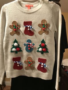 a white sweater with christmas decorations on it