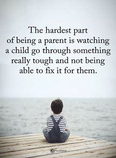 a person sitting on top of a wooden dock next to the ocean with a quote about being a parent