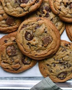 chocolate chip cookies on a baking sheet ready to be eaten