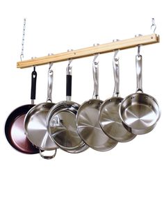 pots and pans are hanging from a rack