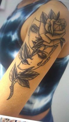 a woman with a rose tattoo on her arm