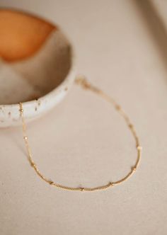 Our most popular layering chain is now available as an anklet! Tiny dots along this chain add the cutest texture. Available in 8.5-9" and 9.5-10" Available in 14kt Gold Fill + Sterling Silver. Love this chain? Shop our Satellite Choker, Satellite Chain and Satellite Bracelet. Handmade in Eau Claire, WI. Our jewelry is handmade so each piece will be unique and may vary slightly from what is pictured. Dainty Hypoallergenic Anklets For Everyday Use, Dainty Hypoallergenic Everyday Anklets, Dainty Beaded Chain Bracelet For Everyday, Everyday Gold Chain Anklets, Copper Uses, Adornment Jewelry, Everyday Wear Jewelry, Bracelet Handmade, Jewelry Case