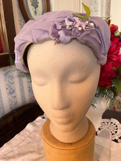 This beauty comes from Camille Hats Styled by Sayles. It's made of sheer layered lavender fabric on a stiffer form, decorated with little purple flowers and green leaves. It measures 11 inches long and 4 inches wide and fits women's size small to large (the mannequin's head measures 19 1/2 inches around). In good vintage condition. Vintage Purple Wedding, Hat With Flowers, Formal Hat, Lavender Fabric, Bridal Hat, Wedding Hat, Fancy Hats, Brown Suede Jacket, Vintage Suede