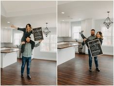 a man and woman holding up a sign in their kitchen