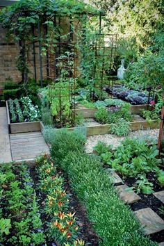 a garden filled with lots of different types of plants and flowers on top of each other