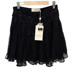 Candela Star Skirt Original Msrp $225.00 Color: Black (**This Listing Is For Black Color Skirt -- Not Blush) Silk Blend. Dry Clean Only. Skirt Measures Approx 16" In Length. Fully Lined. Bead And Rhinestone Detail Throughout. Hidden Side Zipper Closure. Manufacturer Style No. Sk2217. Modeled In Size S. Model Measurements: Height 5'9", Waist 24", Bust 32", Hips 34" Leather Zipper Skirt, Star Skirt, Nordstrom Jeans, Studded Skirt, Charo Ruiz, Silk Mini Skirt, High Waisted Pleated Skirt, Distressed Denim Skirt, Zipper Skirt