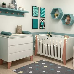 a baby's room decorated in blue and white