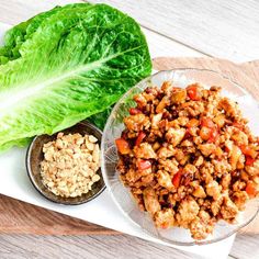 lettuce, meat and other foods are on a plate next to each other