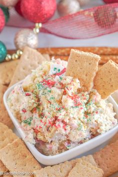 a white bowl filled with crackers and sprinkles