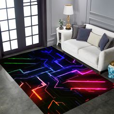 a living room with a couch and rug that has neon lights on it